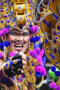 Close-up portrait of man in costume with face paint