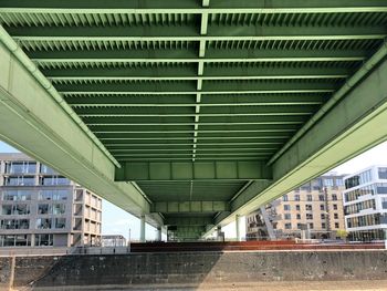 Low angle view of bridge in city