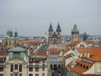 High angle view of buildings in town against sky