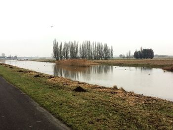 Scenic view of river against clear sky
