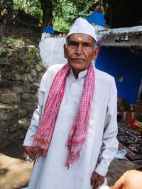 Portrait of smiling man standing outdoors