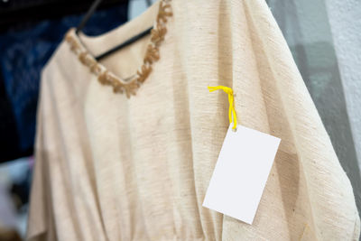 Women's clothes are displayed in a clothing store.