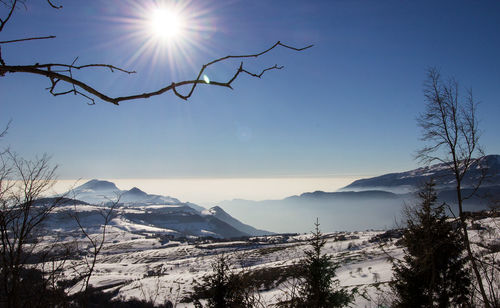 Scenic view of mountains against sky during sunset