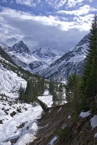 Scenic view of mountains against sky during winter