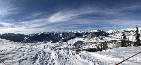 Scenic view of snowcapped mountains against sky