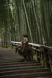 View of a dancing woman in the bamboo forest