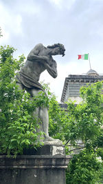 Low angle view of statue against sky