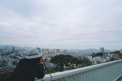 Woman looking at cityscape