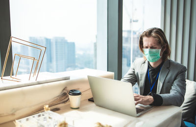 Man using laptop on table