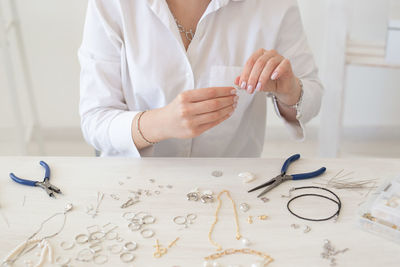 Midsection of woman working on table