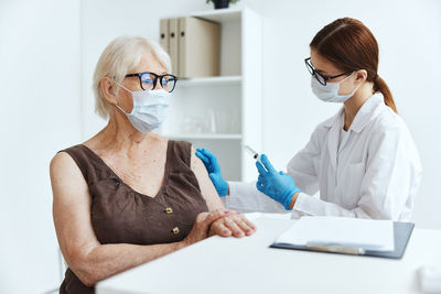 Midsection of woman looking at camera