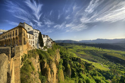 Scenic view of mountains against cloudy sky