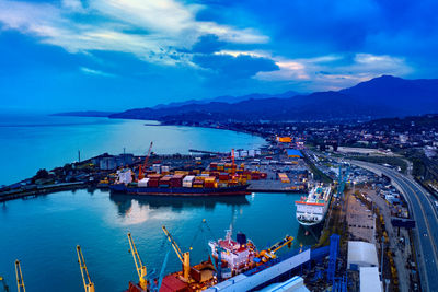 High angle view of harbor against sky in city