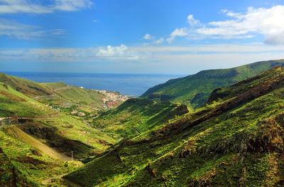 Landscape against calm blue sea and sky