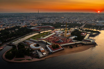 High angle view of city at sunset