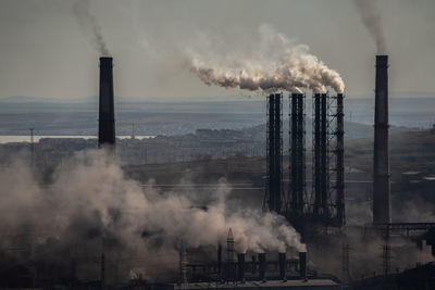 Smoke emitting from chimney at factory