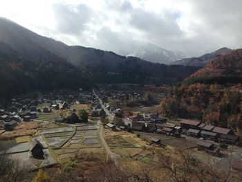 High angle view of trees and buildings against sky