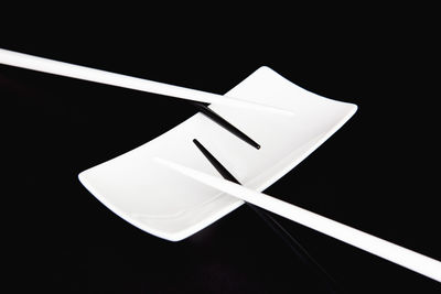 High angle view of white table against black background