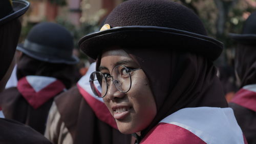 Close-up of woman wearing hat