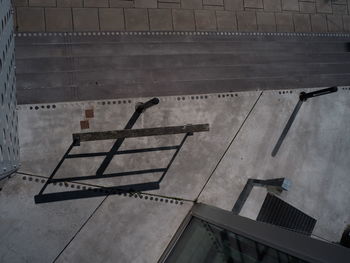 High angle view of metal railing against building