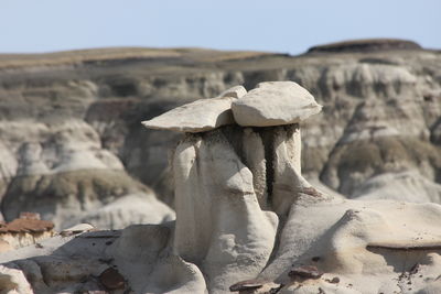 Close-up of rocks against clear sky