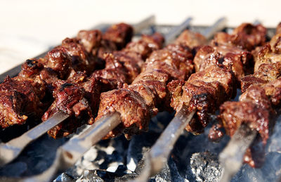Close-up of meat on barbecue grill