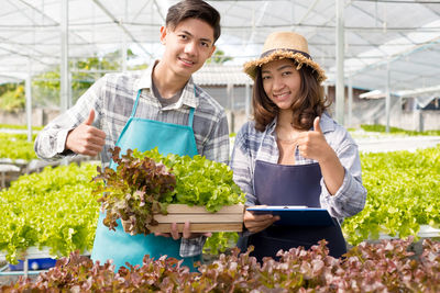 Young man doing working at greenhouse