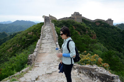 High angle view of a woman standing on great wall of china