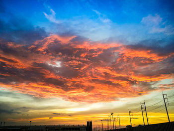 Low angle view of dramatic sky during sunset