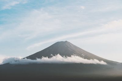 Scenic view of mountains against cloudy sky