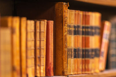 Close up of old books on shelf