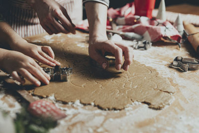 Cropped image of person preparing food on table