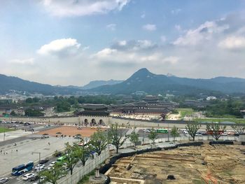 High angle view of road by buildings against sky