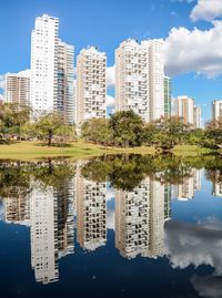 Apartment buildings reflecting in water