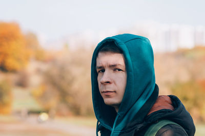 Portrait of a smiling adult man outdoors in casual clothes. travel, active lifestyle