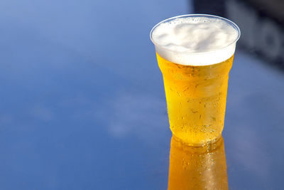 Close-up of beer glass on table