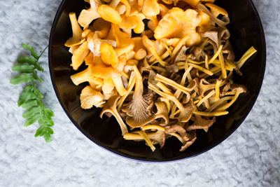 High angle view of chanterelles in bowl on table