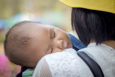 Close-up portrait of a mother and son