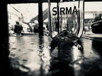 Close-up of wet glass on table