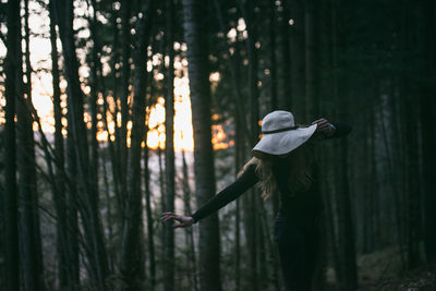 Man holding tree in water