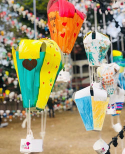 Close-up of multi colored heart shape hanging on street