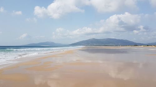 Scenic view of beach against sky