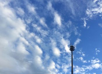 Low angle view of street light against cloudy sky