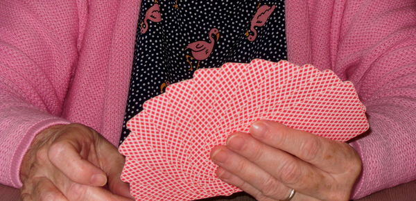 Close-up of woman holding red hand