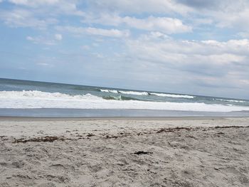 Scenic view of beach against sky