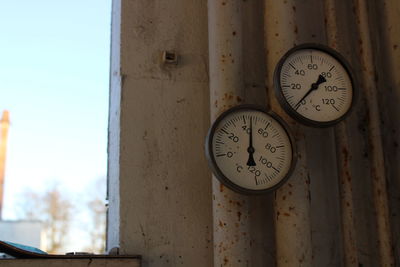 Close-up of clock on wall