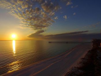 Scenic view of sea against sky at sunset