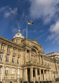 Low angle view of historical building against cloudy sky