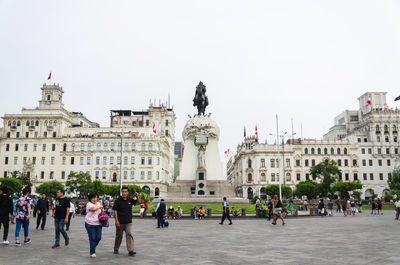 Group of people in front of buildings