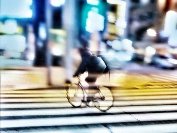 Blurred motion of bicycle on road